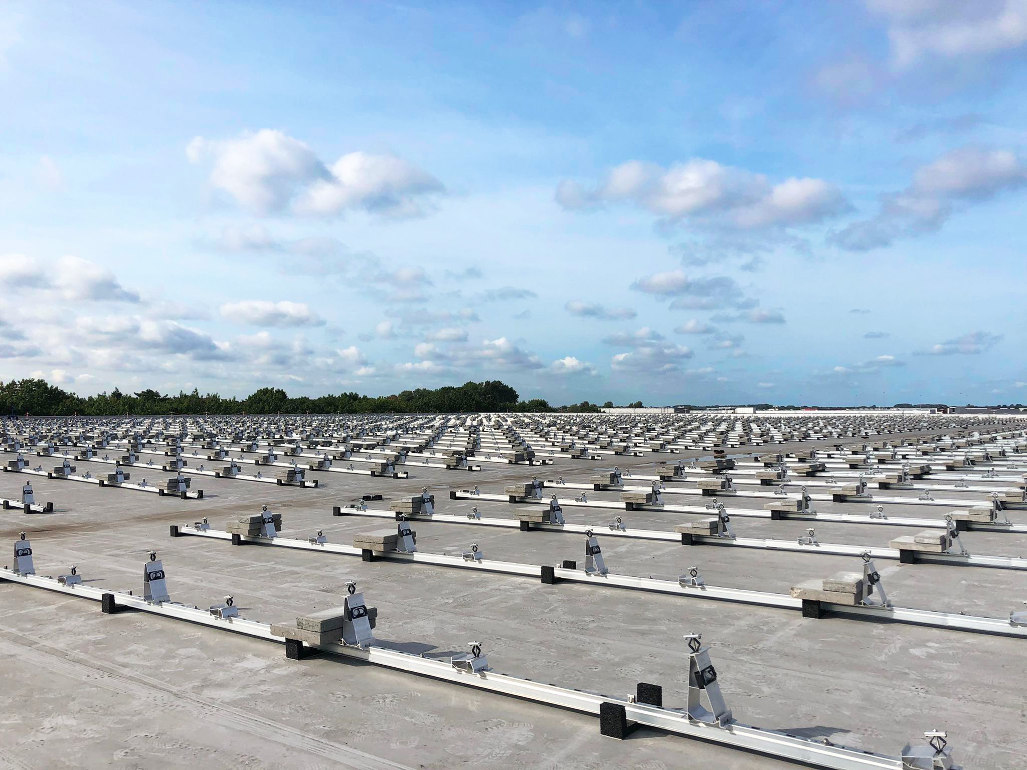 Profiles with ballast on a flat roof - ballasted flat roof solar mount system